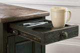 Ashley Furniture Tyler Creek end table with USB ports and outlets, featuring a wooden surface and storage space.
