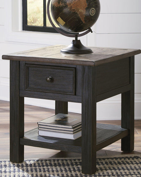 Ashley Furniture Tyler Creek End Table with a wood finish, featuring a simple design and storage shelf for living room decor.