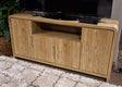 Ashley Furniture Dovander 63-inch TV stand entertainment center with open shelves and closed cabinets for media storage.