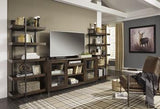 Starmore 3-piece Ashley Furniture entertainment center with TV stand, shelves, and storage cabinets in a modern design.