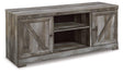 Ashley Furniture Wynnlow 63-inch TV stand entertainment center with open shelves and storage compartments in a modern design.