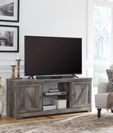 Ashley Furniture Wynnlow 4-piece entertainment center with TV stand, storage cabinets, and open shelving for living room decor.