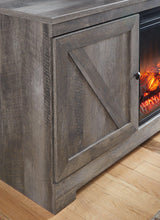 Ashley Furniture Wynnlow 4-piece entertainment center with TV stand, shelves, and storage cabinets in a modern design.