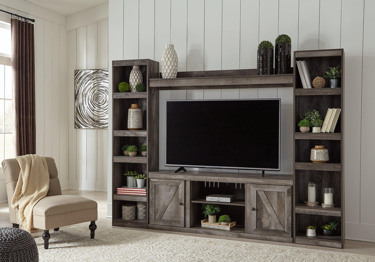 Wynnlow 4-piece entertainment center by Ashley Furniture featuring a modern design with TV stand, storage cabinets, and shelves.