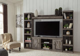 Wynnlow 4-piece entertainment center by Ashley Furniture featuring a modern design with TV stand, storage cabinets, and shelves.