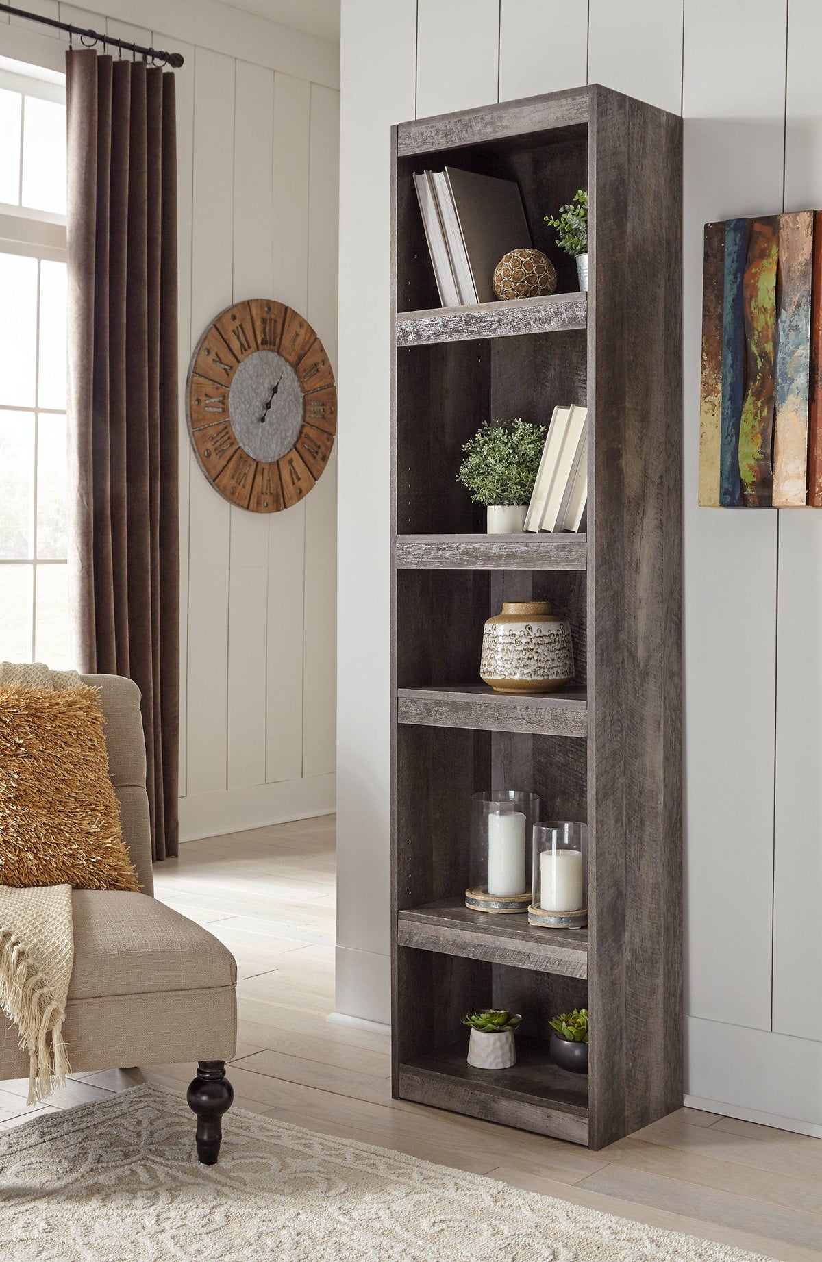 Ashley Wynnlow 4-piece entertainment center with TV stand, shelves, and storage cabinets in a modern wood finish.