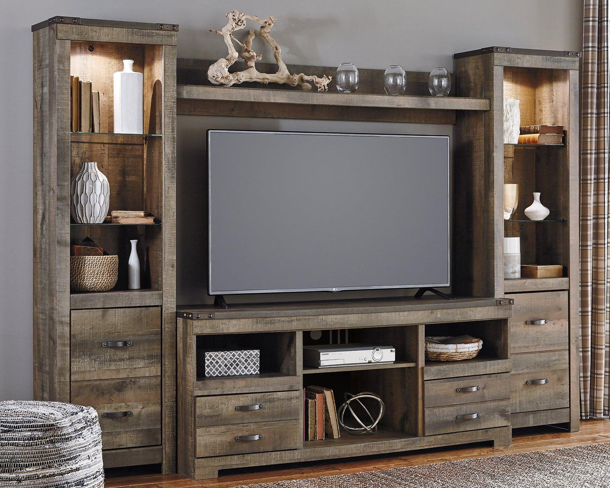 Ashley Trinell 4-Piece Entertainment Center with TV stand, shelves, and storage cabinets in a modern wood finish.
