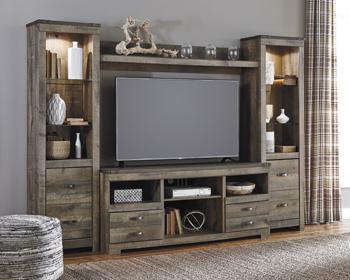 Ashley Furniture Trinell 4-piece entertainment center with TV stand, shelves, and storage cabinets in warm wood finish.