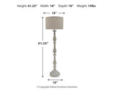 Bernadate floor lamp by Ashley Furniture featuring a sleek design with a tall, modern metal stand and a fabric lampshade.