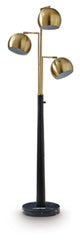 Ashley Furniture Sorcha Floor Lamp with a sleek design and fabric shade, standing on a wooden base in a modern living room setting.