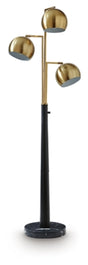 Ashley Furniture Sorcha Floor Lamp with a sleek design and fabric shade, standing on a wooden base in a modern living room setting.