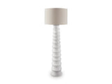 Ashley Veraleigh floor lamp with a tall, elegant design and a fabric shade, perfect for living room or bedroom lighting.