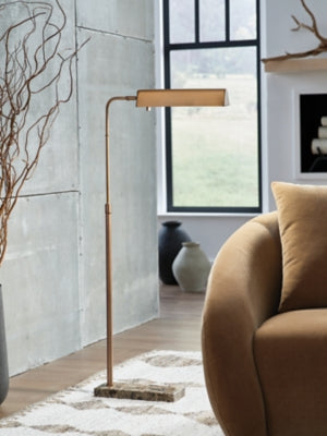 Ashley Furniture Yafe floor lamp with a sleek, modern design featuring a tall metal stand and a fabric lampshade.