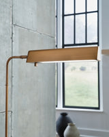 Ashley Furniture Yafe floor lamp with a sleek design, featuring a tall stand and a modern lampshade for stylish lighting.