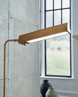 Elegant Ashley Furniture Yafe Floor Lamp with a sleek metal base and fabric shade, ideal for modern living room lighting.