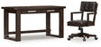 Ashley Furniture Breckington home office set with desk, chair, and storage in a modern design, shown in a well-lit home office space.