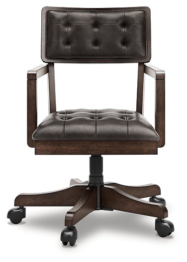 Ashley Furniture Breckington Home Office Set with a desk and matching chair, shown from the front in a modern office setting.