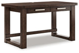 Ashley Furniture Breckington home office set, angled view of desk and storage units in a modern office space.