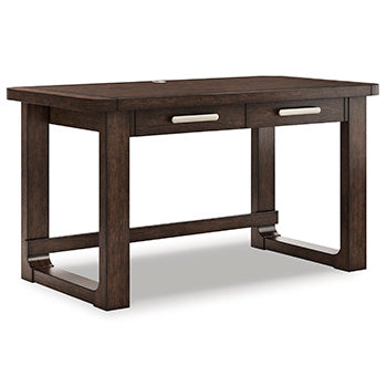 Ashley Furniture Breckington Home Office Set with desk and shelving, shown from a side angle in a modern home workspace setting.
