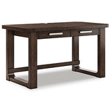 Ashley Furniture Breckington Home Office Set with desk and shelving, shown from a side angle in a modern home workspace setting.