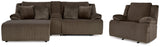 Ashley Furniture Top Tier living room set with sofa, armchairs, and coffee table arranged in a modern, stylish living space.