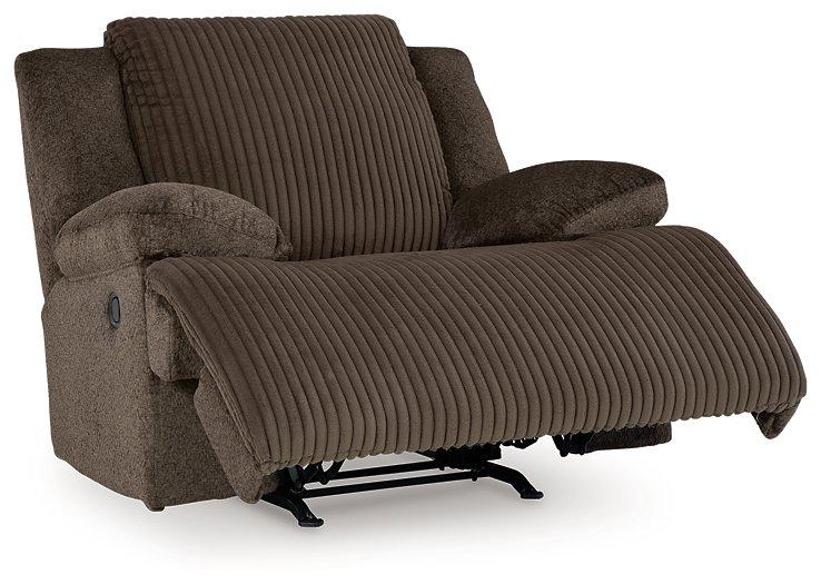 Ashley Furniture Top Tier living room set featuring a sofa, armchair, and coffee table in a modern living space.
