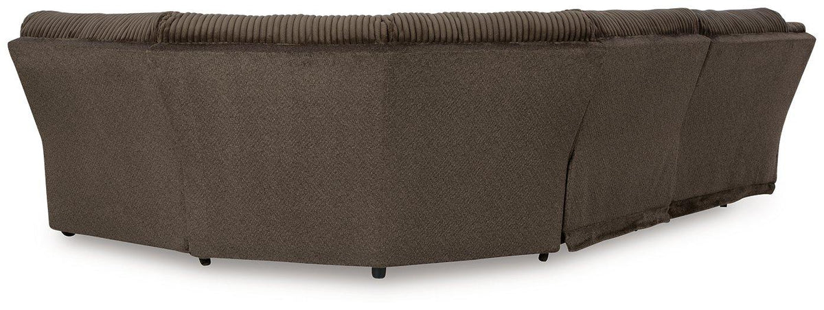 Ashley Furniture Top Tier living room set with sofa, armchairs, and coffee table arranged in a modern living space.