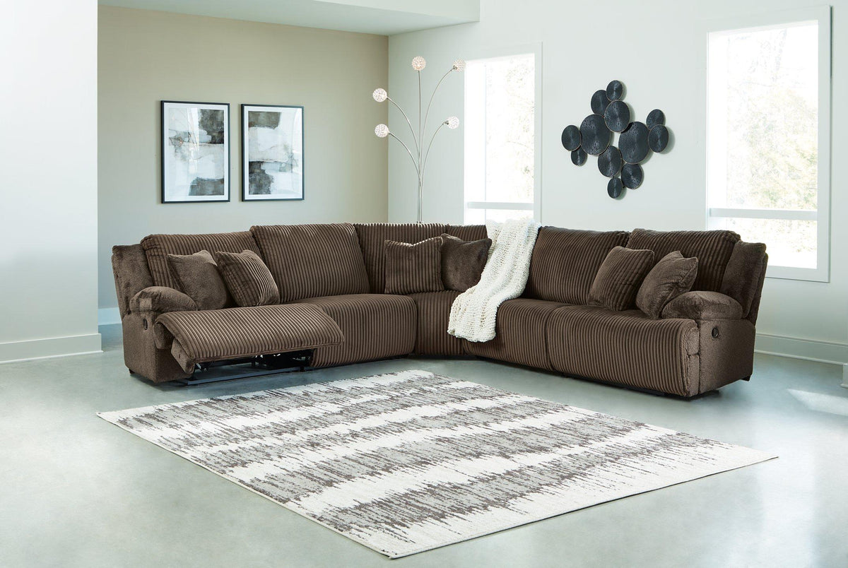 Ashley Furniture Top Tier living room set featuring a sofa, armchair, and coffee table in a modern design.