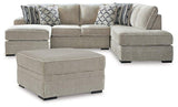 Ashley Furniture Calnita living room set with a sofa and matching chairs, featuring modern design and neutral upholstery.