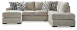Ashley Furniture Calnita living room set featuring a sofa and loveseat with plush cushions and stylish fabric upholstery.