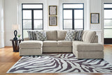Ashley Furniture Calnita living room set with a sofa, loveseat, and armchair in a modern fabric, arranged in a stylish living space.