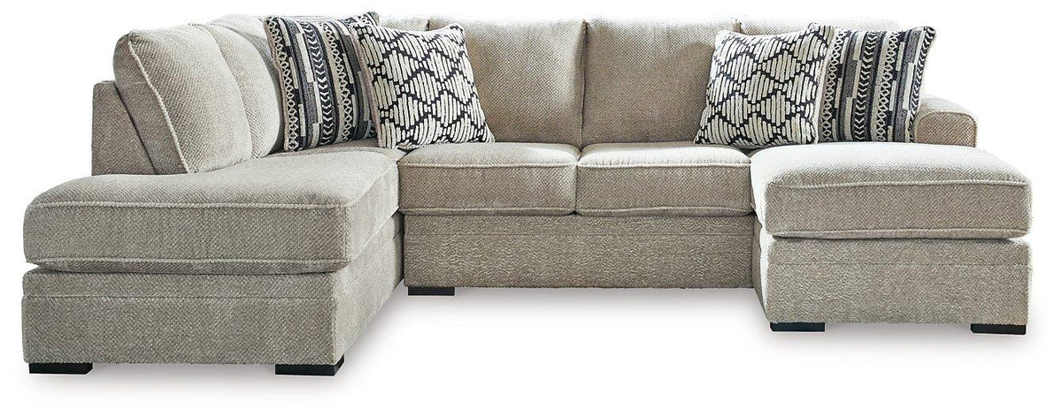 Ashley Furniture Calnita Living Room Set with plush sofa and armchairs, featuring neutral upholstery and modern design.