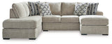 Ashley Furniture Calnita Living Room Set with plush sofa and armchairs, featuring neutral upholstery and modern design.