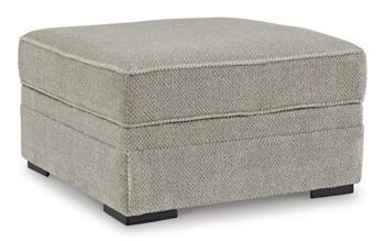 Ashley Furniture Calnita living room set featuring a modern sofa and matching armchair with plush upholstery.