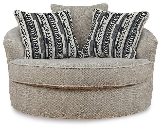 Ashley Furniture Calnita living room set featuring a sofa, loveseat, and armchair in a modern, cozy design with neutral upholstery.