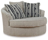 Ashley Calnita living room set featuring a sofa and loveseat with beige upholstery and plush cushions in a modern style.