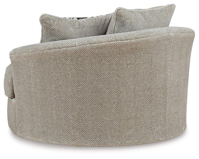 Ashley Furniture Calnita living room set with sofa and armchair, featuring neutral upholstery and modern design.