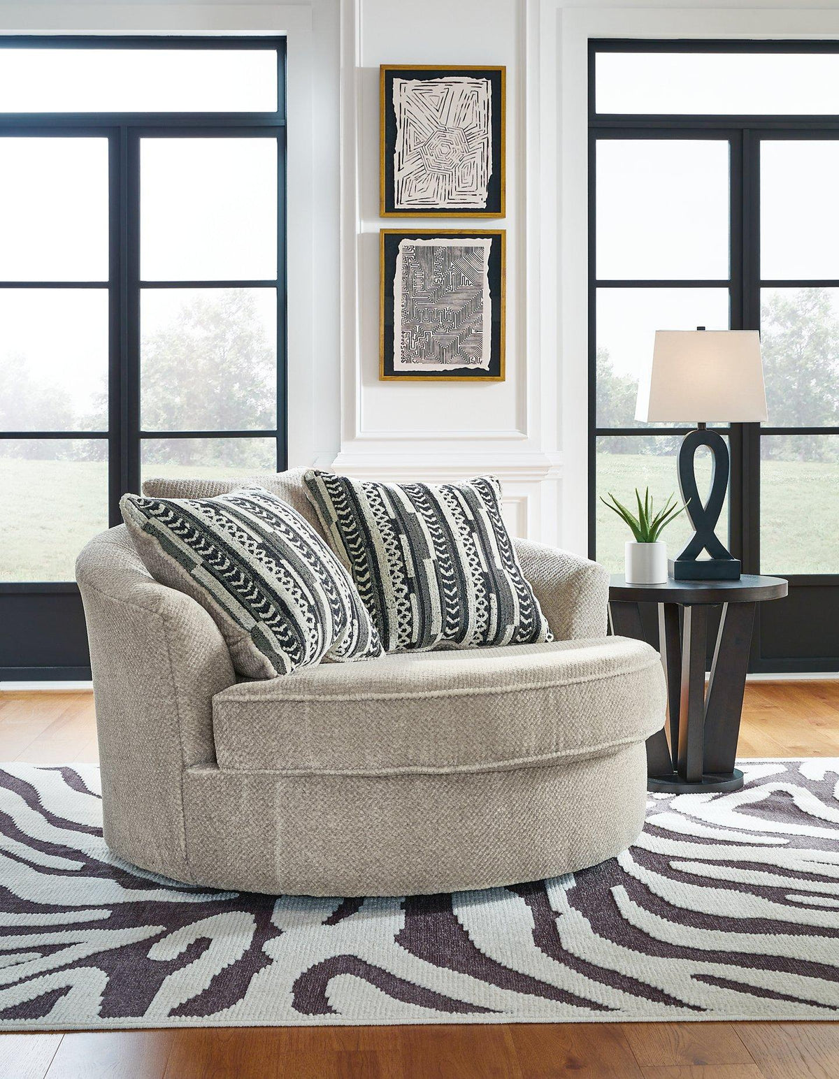 Ashley Furniture Calnita living room set with a sofa and loveseat in a modern design, featuring neutral upholstery.