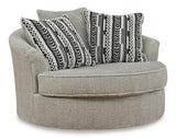 Ashley Calnita living room set featuring a sofa, loveseat, and armchair with neutral fabric upholstery and modern design.