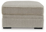 Ashley Furniture Calnita living room set featuring a sofa and loveseat with neutral upholstery and modern design.