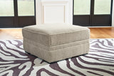 Ashley Furniture Calnita living room set with sofa, loveseat, and coffee table, featuring modern upholstery and wooden accents.