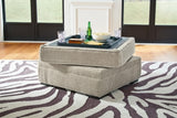 Ashley Furniture Calnita living room set featuring a sofa and loveseat with neutral fabric upholstery and stylish cushions.