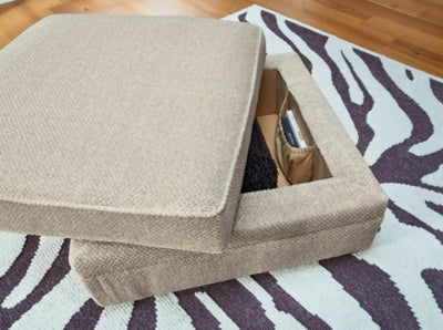 Ashley Furniture Calnita living room set with sofa and loveseat in neutral upholstery, detailed close-up of fabric and cushion textures.