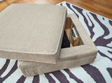 Ashley Furniture Calnita living room set with sofa and loveseat in neutral upholstery, detailed close-up of fabric and cushion textures.