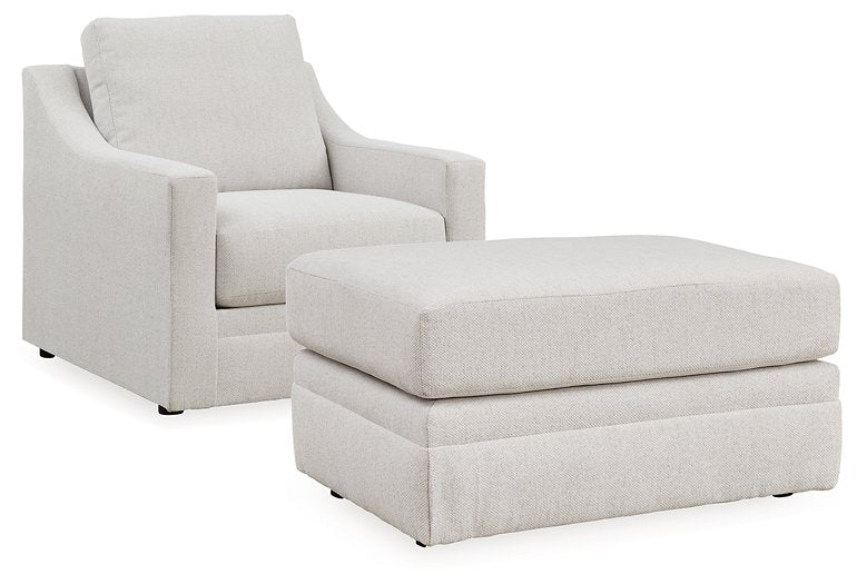 Ashley Furniture Maitelynn upholstery package with a stylish living room set including sofa and accent chairs, in a modern living space.