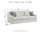 Ashley Furniture Maitelynn upholstery living room set with sofa and loveseat in neutral fabric, modern design, and plush cushions.