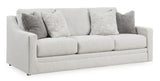 Ashley Furniture Maitelynn upholstery living room set with plush cushions and fabric upholstery, showcasing a stylish sofa and matching pieces.