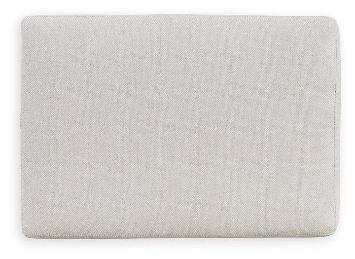 Ashley Furniture Maitelynn living room set with sofa, loveseat, and armchair in neutral upholstery, arranged in a modern living space.