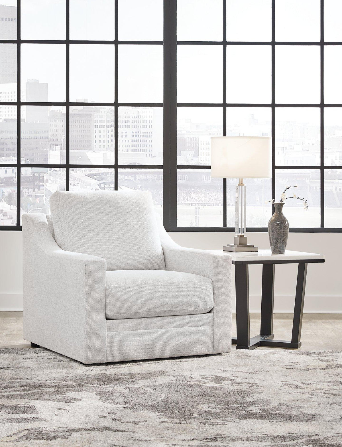 Ashley Furniture Maitelynn upholstery living room set with plush sofa and matching armchair in a modern design.