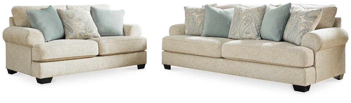 Ashley Monaghan living room set with sofa, loveseat, and armchair in neutral fabric, modern design for cozy family spaces.